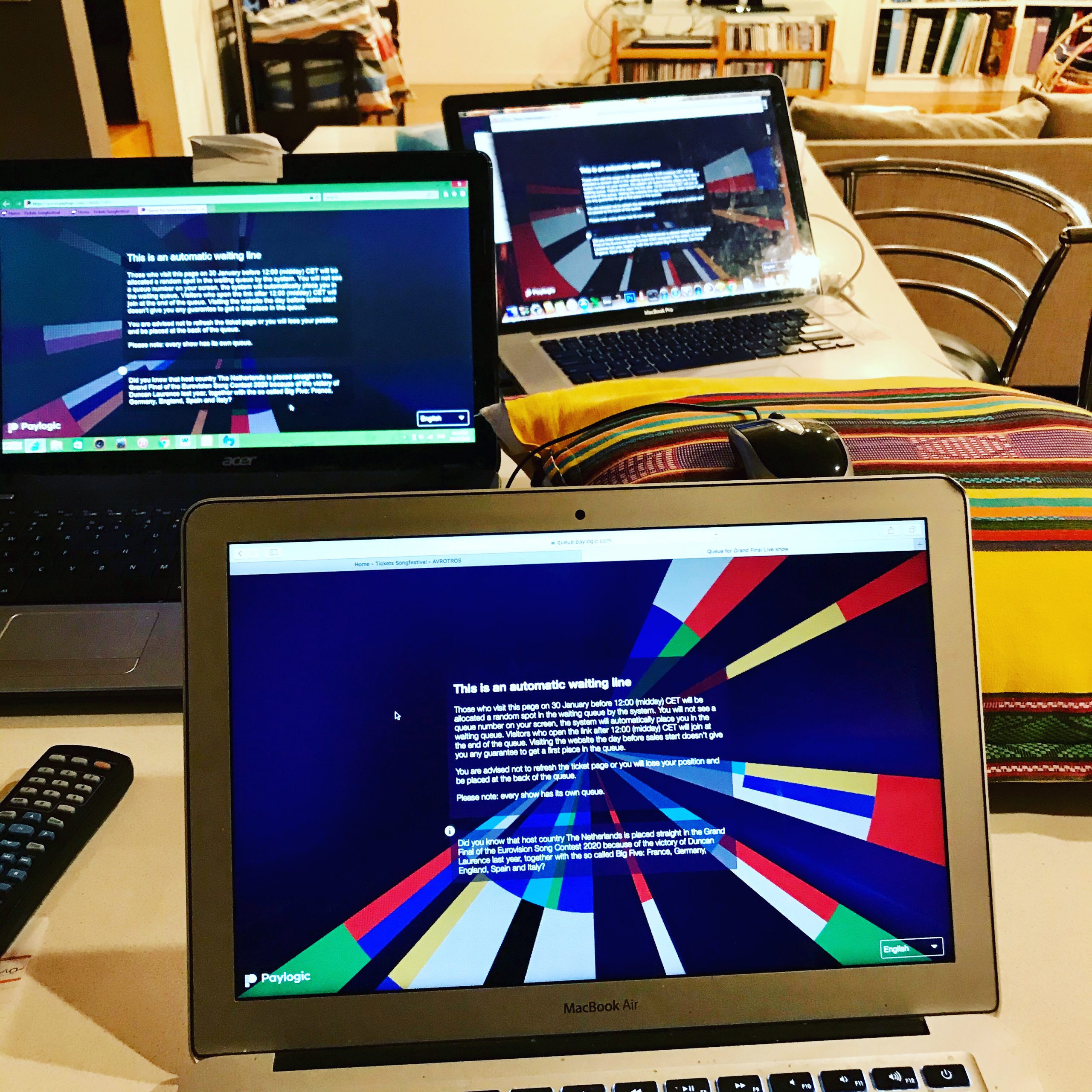 Three laptops open at the Eurovision booking page