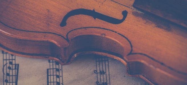 Violin resting on sheet music