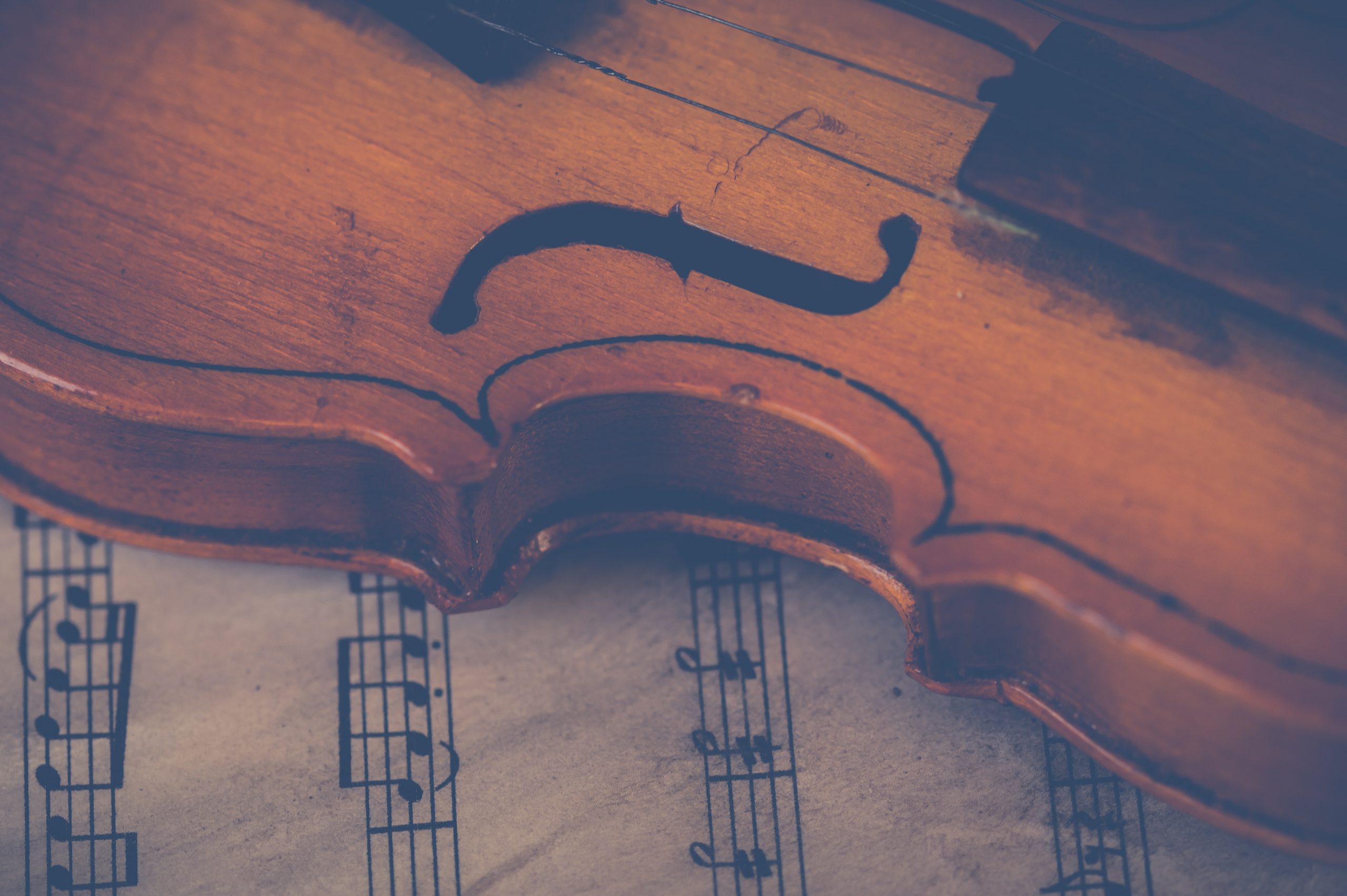 Violin resting on sheet music