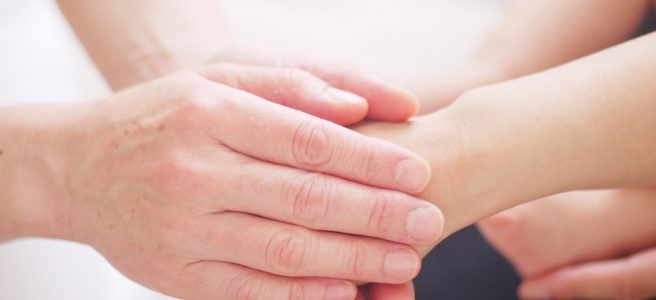 Close up of a hand being held.